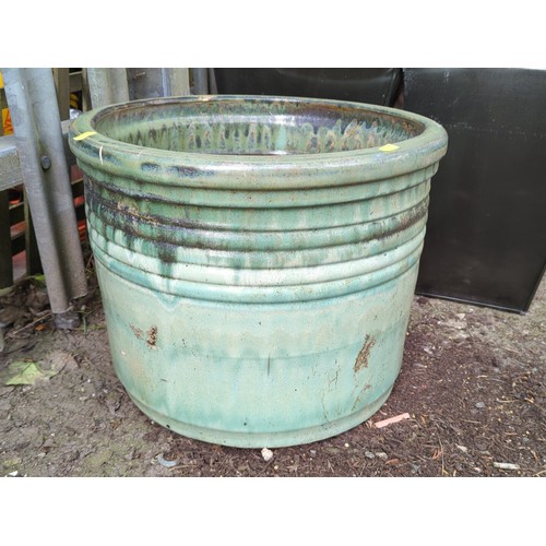 79 - Large glazed stoneware jardinière of cylindrical form with everted rim and moulded horizontal bands... 