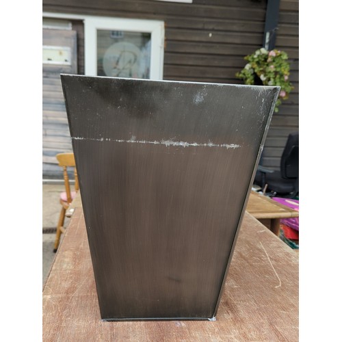 80 - A pair of black metal tapering square-plan planters, each of open top form with rolled rim and reces... 
