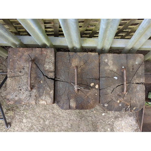 82 - A group of 3 timber blocks fitted with an iron staple handle to the top.