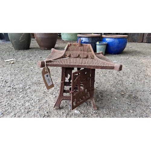 86 - Cast iron garden lantern of pagoda form, raised on four splayed legs.