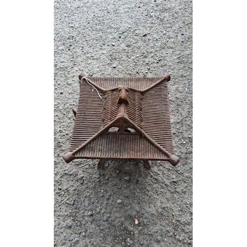 86 - Cast iron garden lantern of pagoda form, raised on four splayed legs.