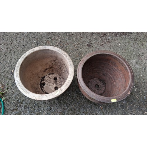 88 - A pair of ceramic garden planters, one green-glazed, the other terracotta; drainage holes to bases.