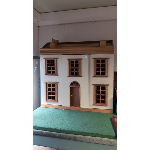 156 - Folding wooden doll’s house with painted cream façade, six-paned windows, central arched door, and p... 