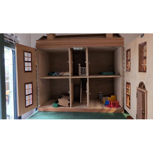 156 - Folding wooden doll’s house with painted cream façade, six-paned windows, central arched door, and p... 