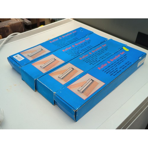 153 - A group of boxed Roller & Bracket Sets for workshop roller tables and conveyor tracks, each prin... 