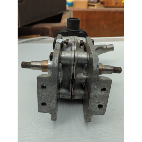 155 - Small air-cooled single-cylinder engine with finned cylinder head, side exhaust outlet, and twin-end... 