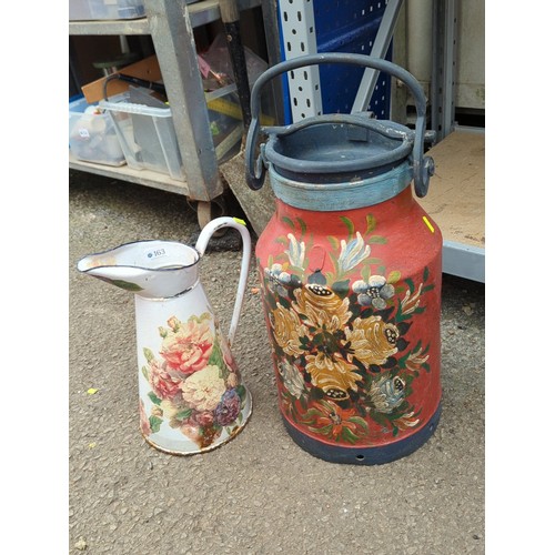 163 - Hand-painted floral milk churn with hinged lid and swing handle, together with an enamelled ewer.