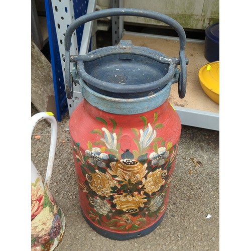 163 - Hand-painted floral milk churn with hinged lid and swing handle, together with an enamelled ewer.