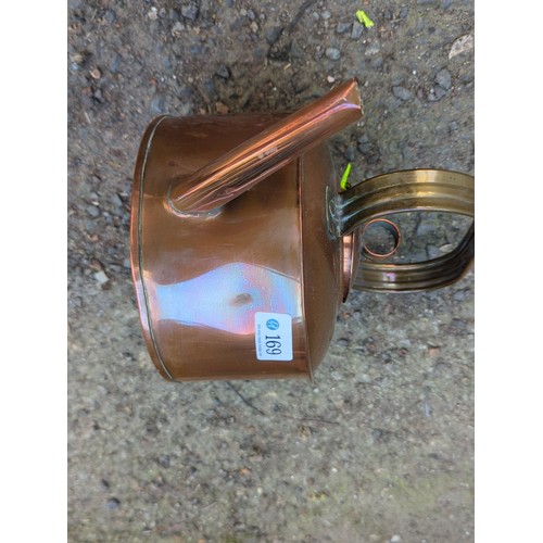 169 - Copper kettle, fitted with a brass handle.