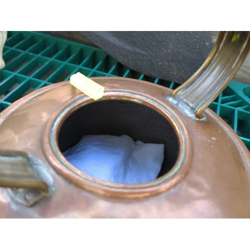 169 - Copper kettle, fitted with a brass handle.