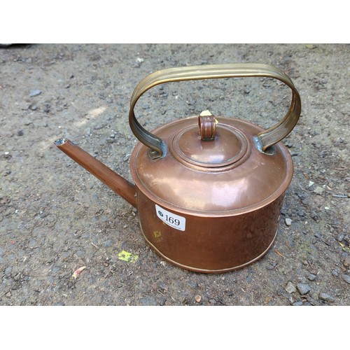 169 - Copper kettle, fitted with a brass handle.