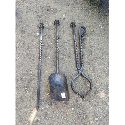 170 - A set of bespoke wrought-iron fireplace tools made by James Kendrew  comprising a poker, shovel and ... 