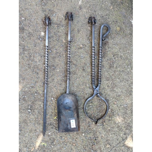 170 - A set of bespoke wrought-iron fireplace tools made by James Kendrew  comprising a poker, shovel and ... 