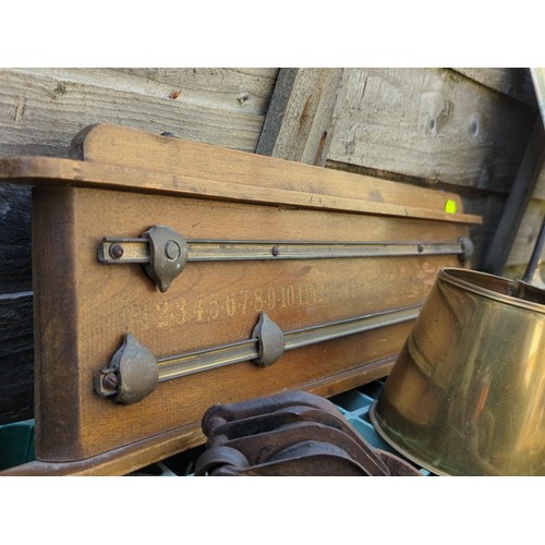 173 - A mixed lot of brass and ironware including two long-handled cider measures, various horse brasses o... 