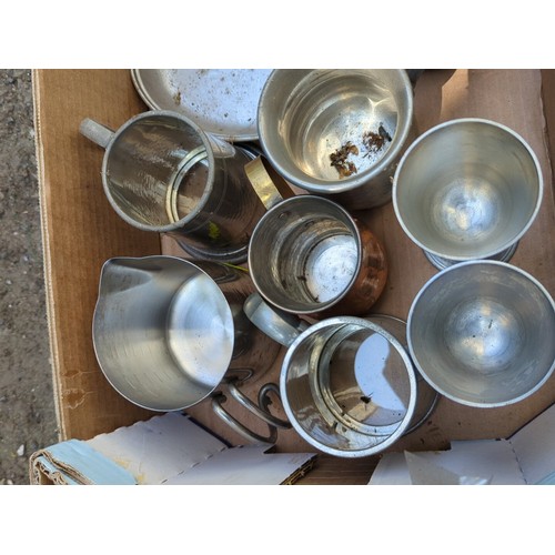 177 - A group of metal tavern and kitchen wares, including pewter goblets and mugs, a lidded tankard, grad... 
