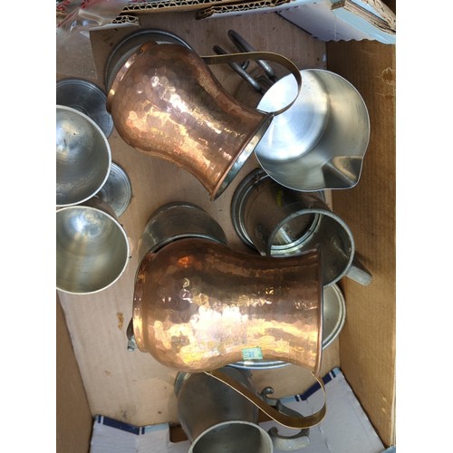 177 - A group of metal tavern and kitchen wares, including pewter goblets and mugs, a lidded tankard, grad... 