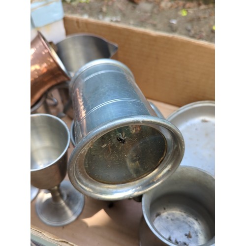 177 - A group of metal tavern and kitchen wares, including pewter goblets and mugs, a lidded tankard, grad... 