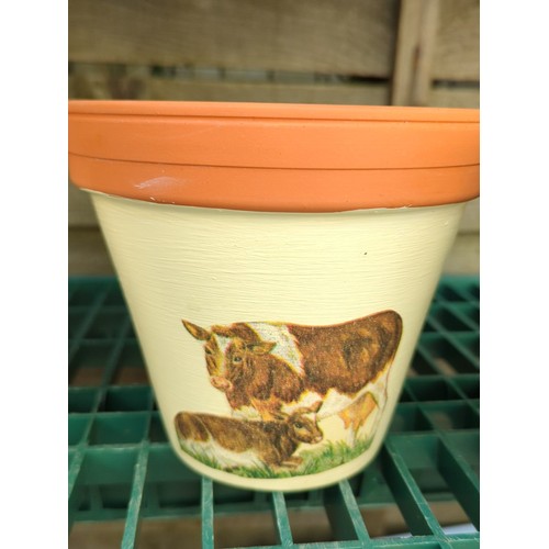 179 - Four painted terracotta flowerpots.