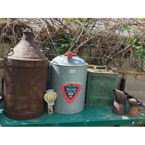 183 - A group of industrial metal containers and automobilia, including an embossed B.P. can, a galvanised... 