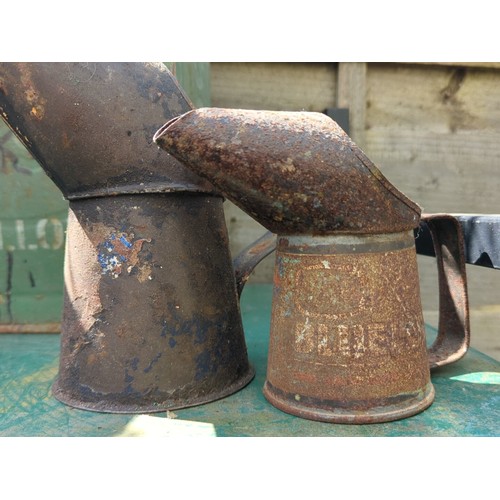 183 - A group of industrial metal containers and automobilia, including an embossed B.P. can, a galvanised... 
