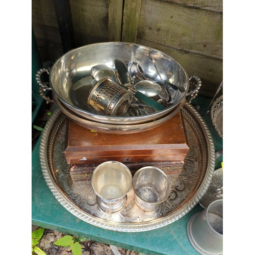 185 - A group of tablewares including an engraved oval tray, twin-handled bowl with assorted flatware, thr... 
