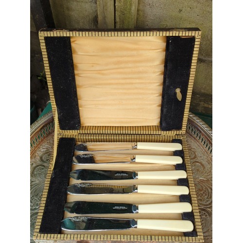 185 - A group of tablewares including an engraved oval tray, twin-handled bowl with assorted flatware, thr... 