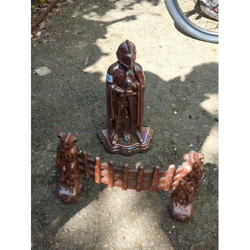 186 - Late 19th/early 20th century cast-iron fireplace companion set—an armoured knight-form tool stand, f... 