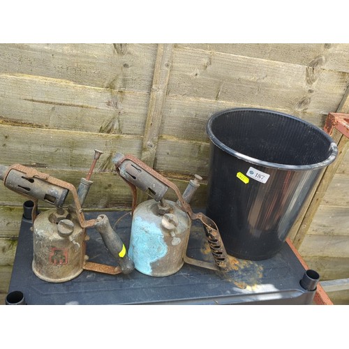 187 - Two vintage paraffin blowlamps, together with a black plastic bucket.