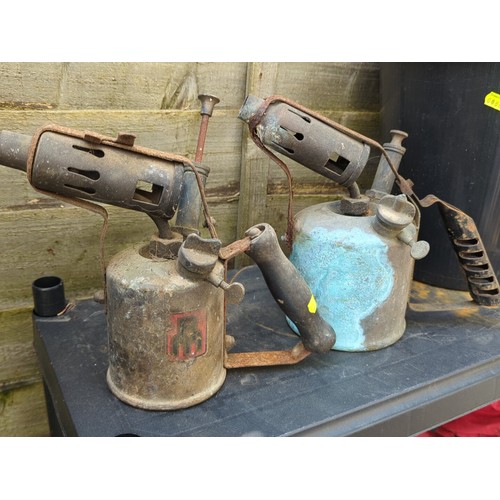 187 - Two vintage paraffin blowlamps, together with a black plastic bucket.