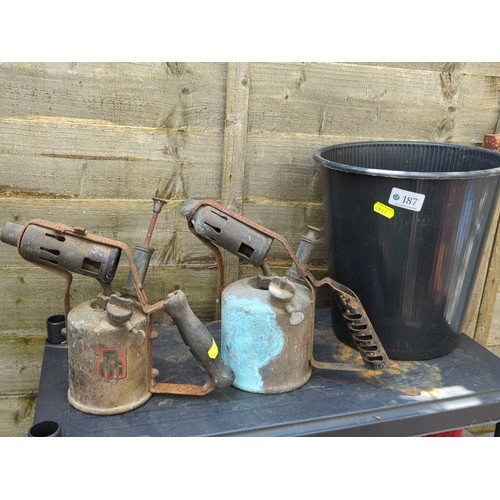 187 - Two vintage paraffin blowlamps, together with a black plastic bucket.