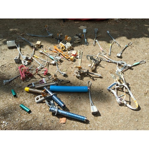 188 - A group of rock-climbing hardware, comprising assorted nuts, hexes, camming devices, slings and cara... 