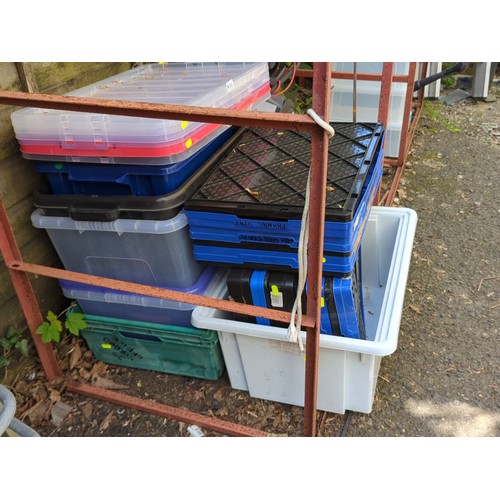 193 - A group of plastic storage containers and lidded crates.