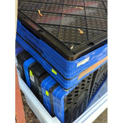 193 - A group of plastic storage containers and lidded crates.