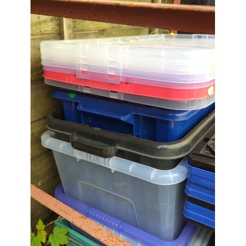 193 - A group of plastic storage containers and lidded crates.