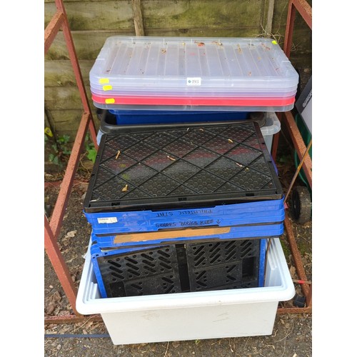 193 - A group of plastic storage containers and lidded crates.