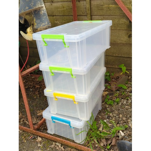 196 - A group of clear plastic lidded storage boxes with clip-fastening handles in assorted colours.