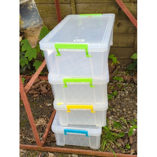 196 - A group of clear plastic lidded storage boxes with clip-fastening handles in assorted colours.