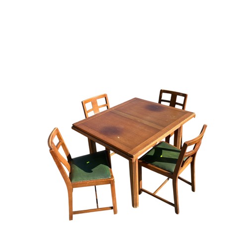 246 - Mid-Century extending dining table with 4 matching green leather topped chairs.