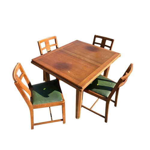 246 - Mid-Century extending dining table with 4 matching green leather topped chairs.