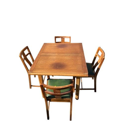 246 - Mid-Century extending dining table with 4 matching green leather topped chairs.