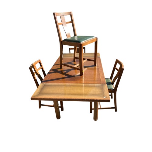 246 - Mid-Century extending dining table with 4 matching green leather topped chairs.