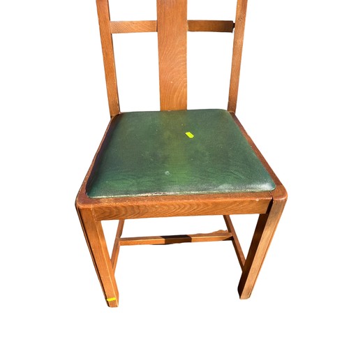 246 - Mid-Century extending dining table with 4 matching green leather topped chairs.