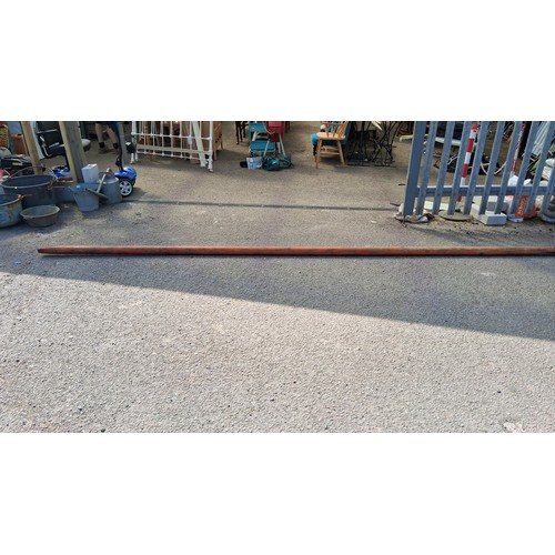 198 - An antique wooden mast.