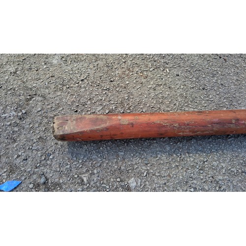 198 - An antique wooden mast.