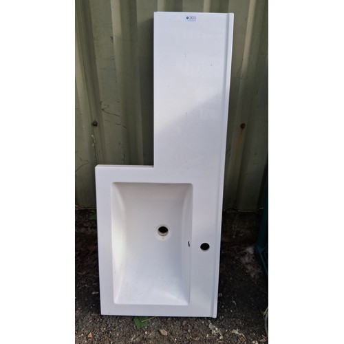 203 - Modern L-shaped white vanity top, with integrated  basin, central waste aperture, and pre-drilled ta... 