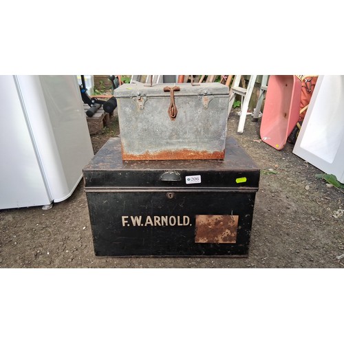 206 - Two galvanised steel storage chests, one painted black and stencilled ‘F.W. ARNOLD’.