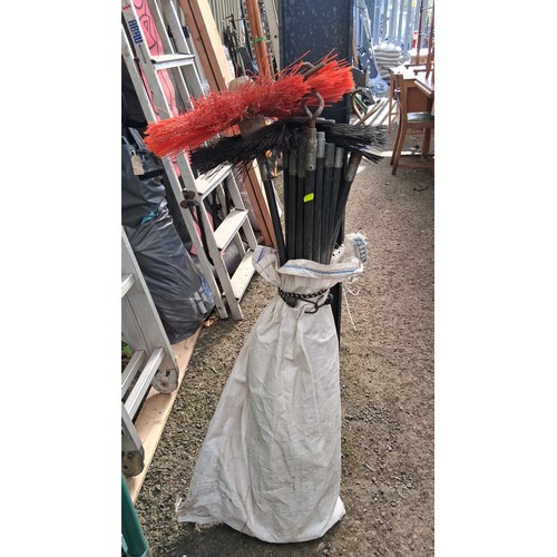 208 - An assortment of chimney-sweep rods and fittings, including nylon brush heads, circular scraper disc... 