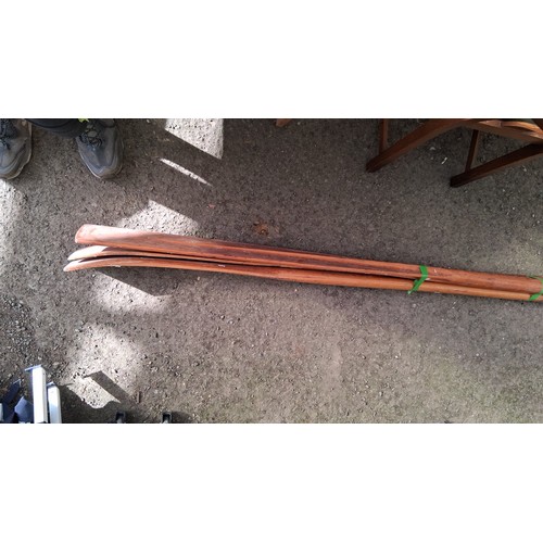221 - A pair of wooden oars, together with manual rudder.