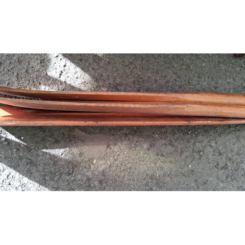 221 - A pair of wooden oars, together with manual rudder.