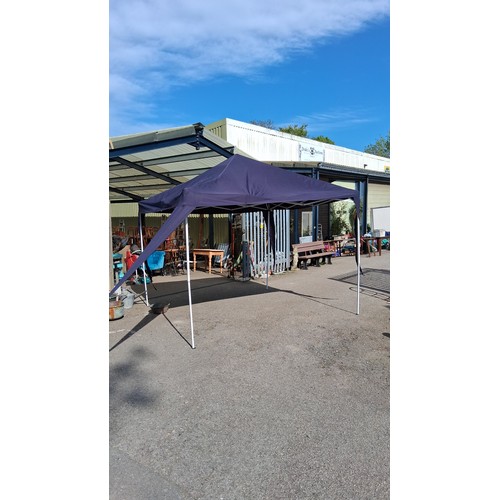 226 - Collapsible pop-up gazebo with navy polyester canopy and white metal scissor-frame supports; shown a... 